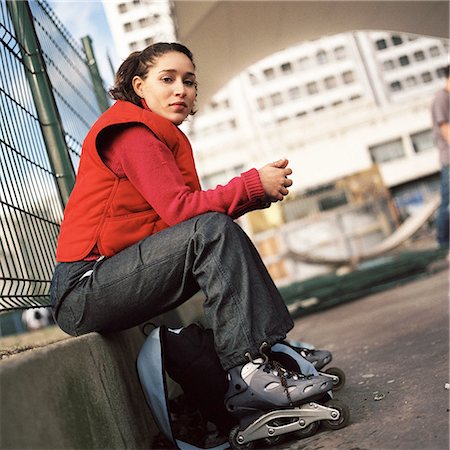 Young woman wearing inline skates, portrait Stock Photo - Premium Royalty-Free, Code: 695-03384707