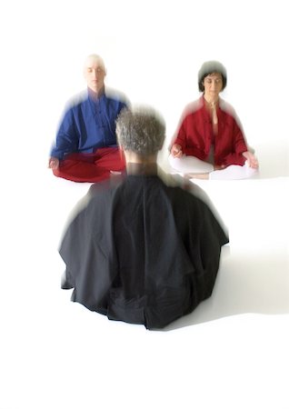 People sitting on floor indian style, meditating, blurred Stock Photo - Premium Royalty-Free, Code: 695-03385778