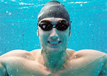 Man smiling underwater, underwater view. Stock Photo - Premium Royalty-Free, Code: 695-03386149