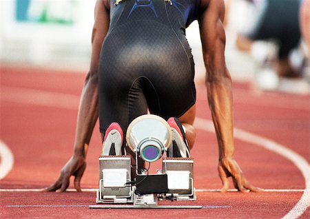 simsearch:695-03386286,k - Male runner on starting block, rear view Stock Photo - Premium Royalty-Free, Code: 695-03386275