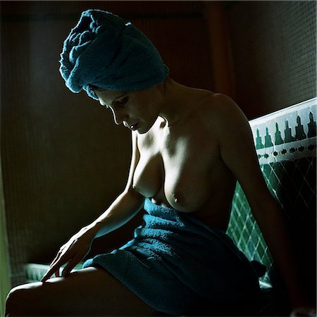 Semi-nude woman sitting in hammam Stock Photo - Premium Royalty-Free, Code: 695-03386620