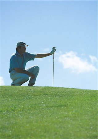 simsearch:862-03889244,k - Golfeur debout sur vert Photographie de stock - Premium Libres de Droits, Code: 695-03388226