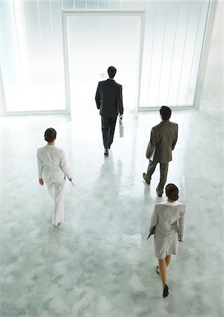 simsearch:695-03386286,k - Four executives walking across lobby toward exit Stock Photo - Premium Royalty-Free, Code: 695-03388323