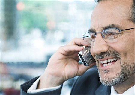 simsearch:695-03376228,k - Businessman talking on cell phone Stock Photo - Premium Royalty-Free, Code: 695-03388390