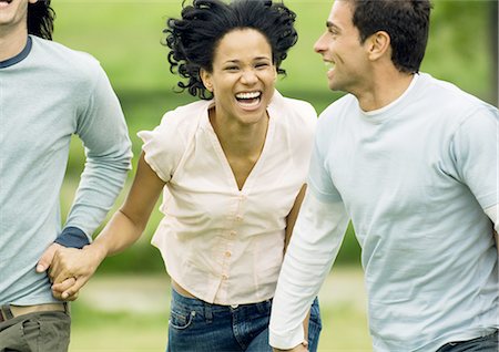 simsearch:695-03382482,k - Young friends running and laughing Stock Photo - Premium Royalty-Free, Code: 695-03388549