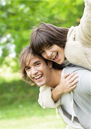 simsearch:695-03382482,k - Portrait of smiling young couple, woman on man's back Stock Photo - Premium Royalty-Free, Code: 695-03388542