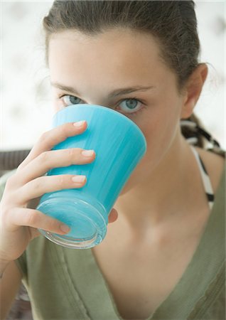 simsearch:6108-07969525,k - Teenage girl drinking from cup Stock Photo - Premium Royalty-Free, Code: 695-03388762