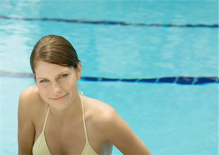 simsearch:695-03374346,k - Woman smiling, poolside Stock Photo - Premium Royalty-Free, Code: 695-03388781
