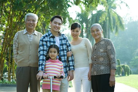 simsearch:6116-06939008,k - Three generation family in park, portrait Stock Photo - Premium Royalty-Free, Code: 695-03388963