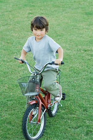 riding bike with basket - Boy on bike, full length Stock Photo - Premium Royalty-Free, Code: 695-03389053