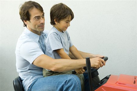 simsearch:632-03848361,k - Father and son on riding lawn mower together Stock Photo - Premium Royalty-Free, Code: 695-03389256