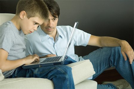 simsearch:614-06442812,k - Father and son using laptop together Stock Photo - Premium Royalty-Free, Code: 695-03389259