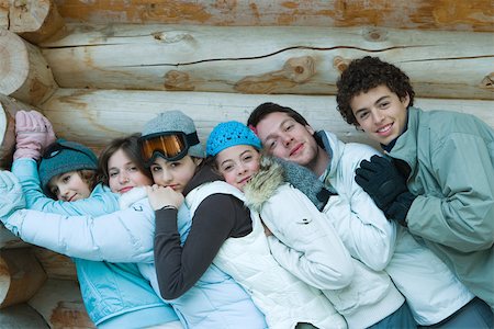simsearch:695-03382482,k - Young friends standing by log cabin, leaning on each other, portrait Stock Photo - Premium Royalty-Free, Code: 695-03389268