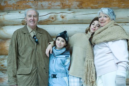 simsearch:696-03401677,k - Grandparents and granddaughters standing by chalet, portrait Stock Photo - Premium Royalty-Free, Code: 695-03389269