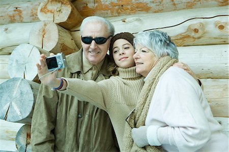 simsearch:696-03401677,k - Teenage girl photographing self with grandparents Stock Photo - Premium Royalty-Free, Code: 695-03389355