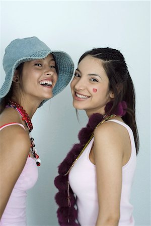 Two young female friends, smiling at camera, portrait Stock Photo - Premium Royalty-Free, Code: 695-03389424