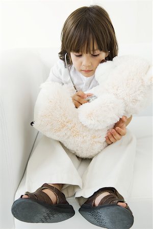 simsearch:695-05768235,k - Little boy playing doctor with stuffed toy, using stethoscope Stock Photo - Premium Royalty-Free, Code: 695-03389914