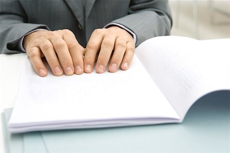 disabled blind - Man reading Braille document at desk, cropped view Stock Photo - Premium Royalty-Free, Code: 695-03380485