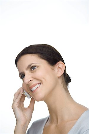 simsearch:695-03376228,k - Woman using cell phone, smiling, head tilted Stock Photo - Premium Royalty-Free, Code: 695-03380514
