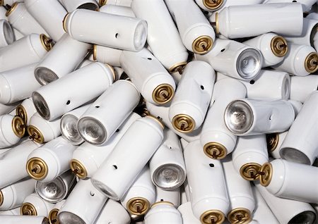 Heap of white, punctured aerosol cans, close-up, full frame Stock Photo - Premium Royalty-Free, Code: 695-03381546