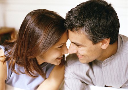 simsearch:614-06896801,k - Woman and man smiling, foreheads and noses touching, side view, close-up Stock Photo - Premium Royalty-Free, Code: 695-03381810