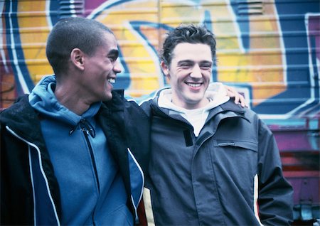 simsearch:695-03382482,k - Two young men, one with arm around the other, smiling Stock Photo - Premium Royalty-Free, Code: 695-03382241