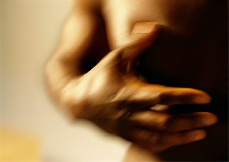 simsearch:695-03382414,k - Man's hand on bare chest, close up, blurred. Stock Photo - Premium Royalty-Free, Code: 695-03382397