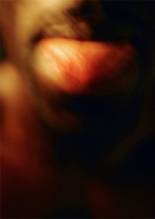 simsearch:695-03382414,k - Man sticking tongue out, close up, blurred. Stock Photo - Premium Royalty-Free, Code: 695-03382451