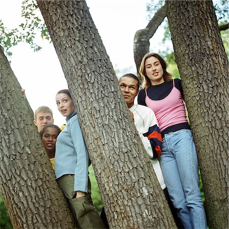 simsearch:695-03382482,k - Young people standing between trees Stock Photo - Premium Royalty-Free, Code: 695-03382476