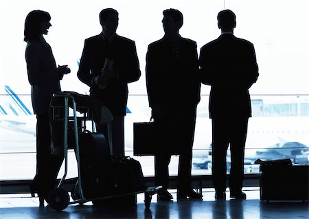 shadow plane - Group of business people standing inside airport, silhouette. Stock Photo - Premium Royalty-Free, Code: 695-03382795