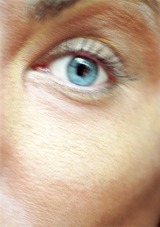 simsearch:649-07436630,k - Woman's blue eye, looking at camera, blurred close up. Stock Photo - Premium Royalty-Free, Code: 695-03383082