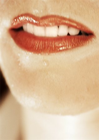 simsearch:700-00606512,k - Woman wearing red lipstick, close up of open mouth and wet skin Stock Photo - Premium Royalty-Free, Code: 695-03383235