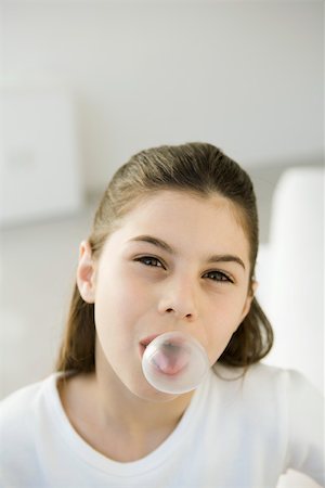 simsearch:632-05604245,k - Girl blowing bubble with chewing gum, portrait Stock Photo - Premium Royalty-Free, Code: 695-03390108