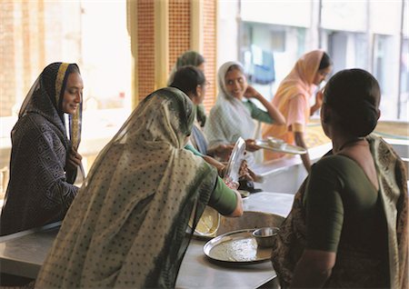 India, Ahmedabad, women doing dishes Stock Photo - Premium Royalty-Free, Code: 696-05780910