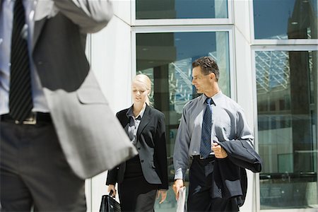 simsearch:632-05401320,k - Two business associates walking together, chatting, three quarter length Stock Photo - Premium Royalty-Free, Code: 696-03394313