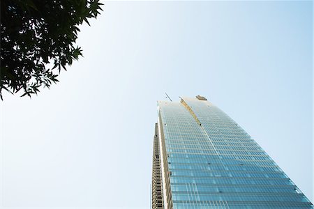 Chine, Province du Guangdong, Guangzhou, immeuble en construction, vue d'angle faible Photographie de stock - Premium Libres de Droits, Code: 696-03394666