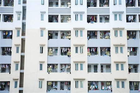 High rise apartment building, laundy hanging out to dry on balconies Stock Photo - Premium Royalty-Free, Code: 696-03394709