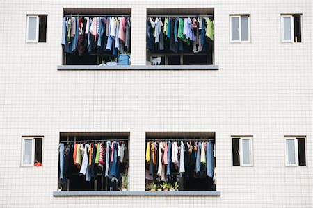 simsearch:696-03395895,k - Laundry hanging to dry in balconies of apartment building Stock Photo - Premium Royalty-Free, Code: 696-03394703