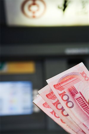 100 Yuan banknotes, AMT in background Stock Photo - Premium Royalty-Free, Code: 696-03395016