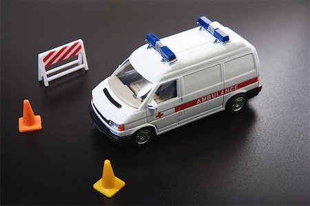 Toy ambulance and traffic cones, close-up Stock Photo - Premium Royalty-Free, Code: 696-03395570