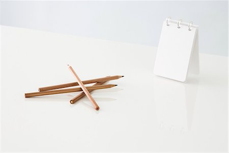 pad of paper - Colored pencils and blank notebook Stock Photo - Premium Royalty-Free, Code: 696-03395857