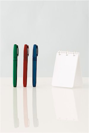 simsearch:6118-07354031,k - Pens and spiral notebook, close-up Stock Photo - Premium Royalty-Free, Code: 696-03395858