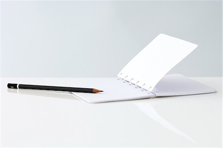 Open notebook and pencil, close-up Stock Photo - Premium Royalty-Free, Code: 696-03395867