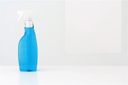 simsearch:696-03395895,k - Spray bottle filled with blue cleaning fluid Stock Photo - Premium Royalty-Free, Code: 696-03396059