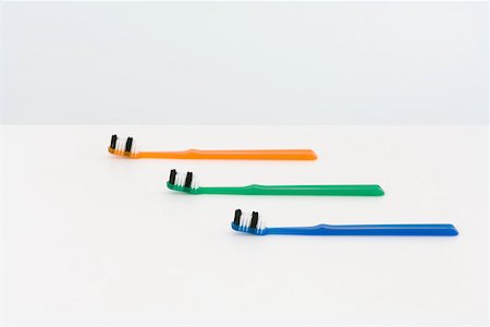 simsearch:696-03395895,k - Three toothbrushes, staggered and colorful Stock Photo - Premium Royalty-Free, Code: 696-03396060