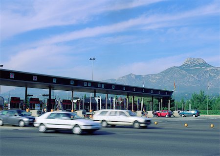 Cars leaving tollbooths Stock Photo - Premium Royalty-Free, Code: 696-03396273