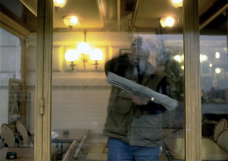 Window washer washing windows inside cafe Stock Photo - Premium Royalty-Free, Code: 696-03396929