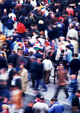 people walking in the distance - Crowd walking in street, blurred. Stock Photo - Premium Royalty-Free, Code: 696-03397053