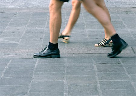 simsearch:695-03378125,k - People walking, view from knees down, blurred. Stock Photo - Premium Royalty-Free, Code: 696-03397413