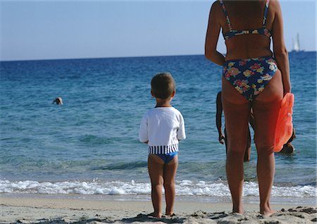 simsearch:696-03399615,k - Mother and son standing on beach, looking at sea, rear view Stock Photo - Premium Royalty-Free, Code: 696-03397597